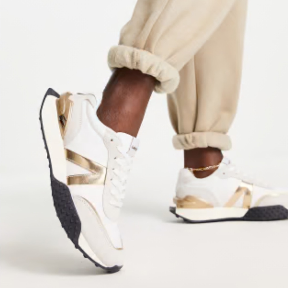 Lacoste L-Spin Deluxe gold sneakers in white leather